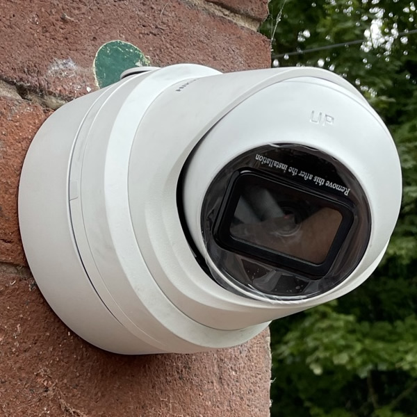 cctv camera installed on a wall of a house